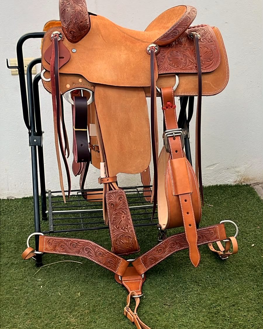 Complete tooled ranch saddle with tack